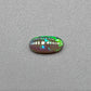 0.5ct Dark Opal with vivid green flash and hints of blue