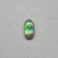 0.5ct Dark Opal with vivid green flash and hints of blue