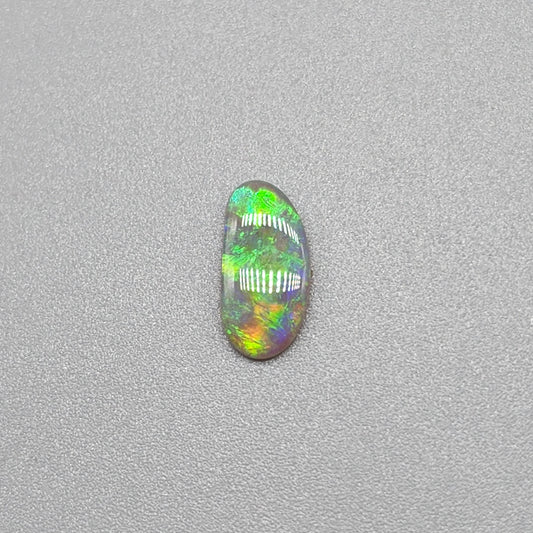 0.65ct Dark Opal with gold green color play