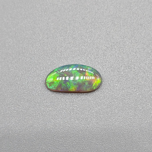 0.65ct Dark Opal with gold green color play