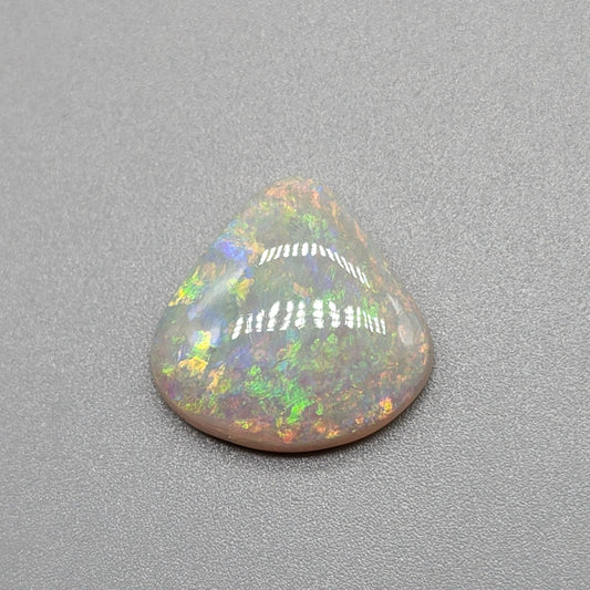 6.4cts Light Opal with yellow and orange color play