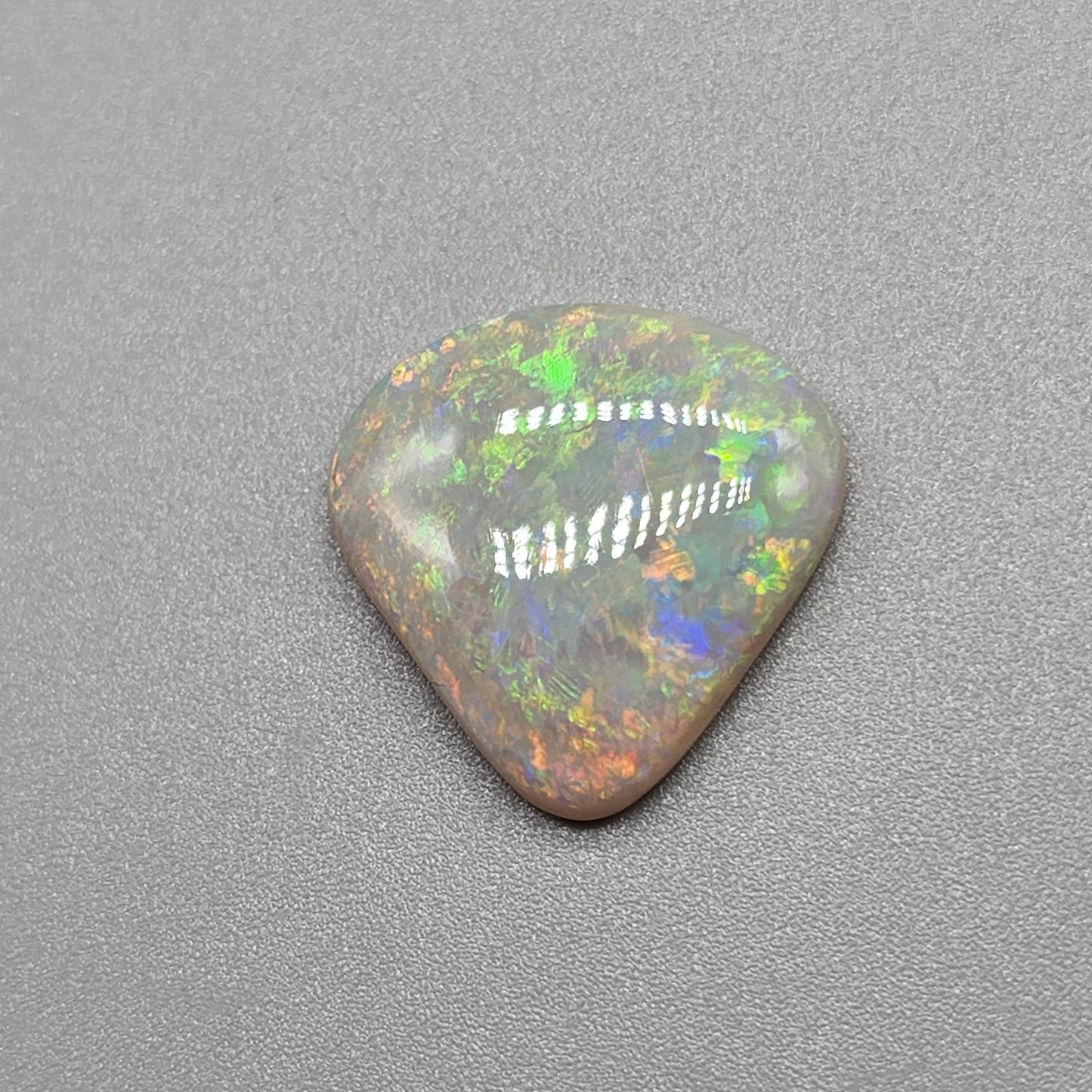 6.4cts Light Opal with yellow and orange color play