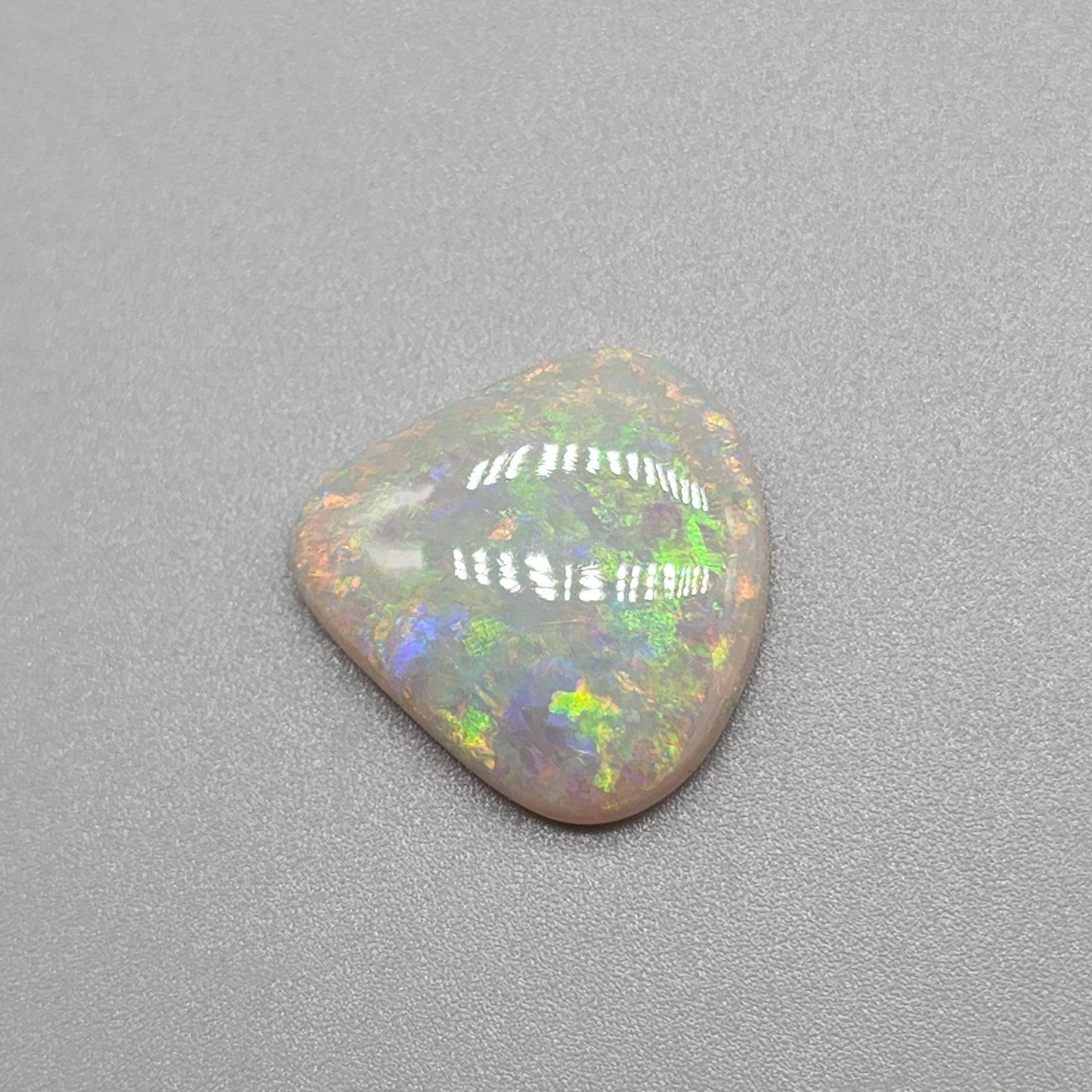 6.4cts Light Opal with yellow and orange color play