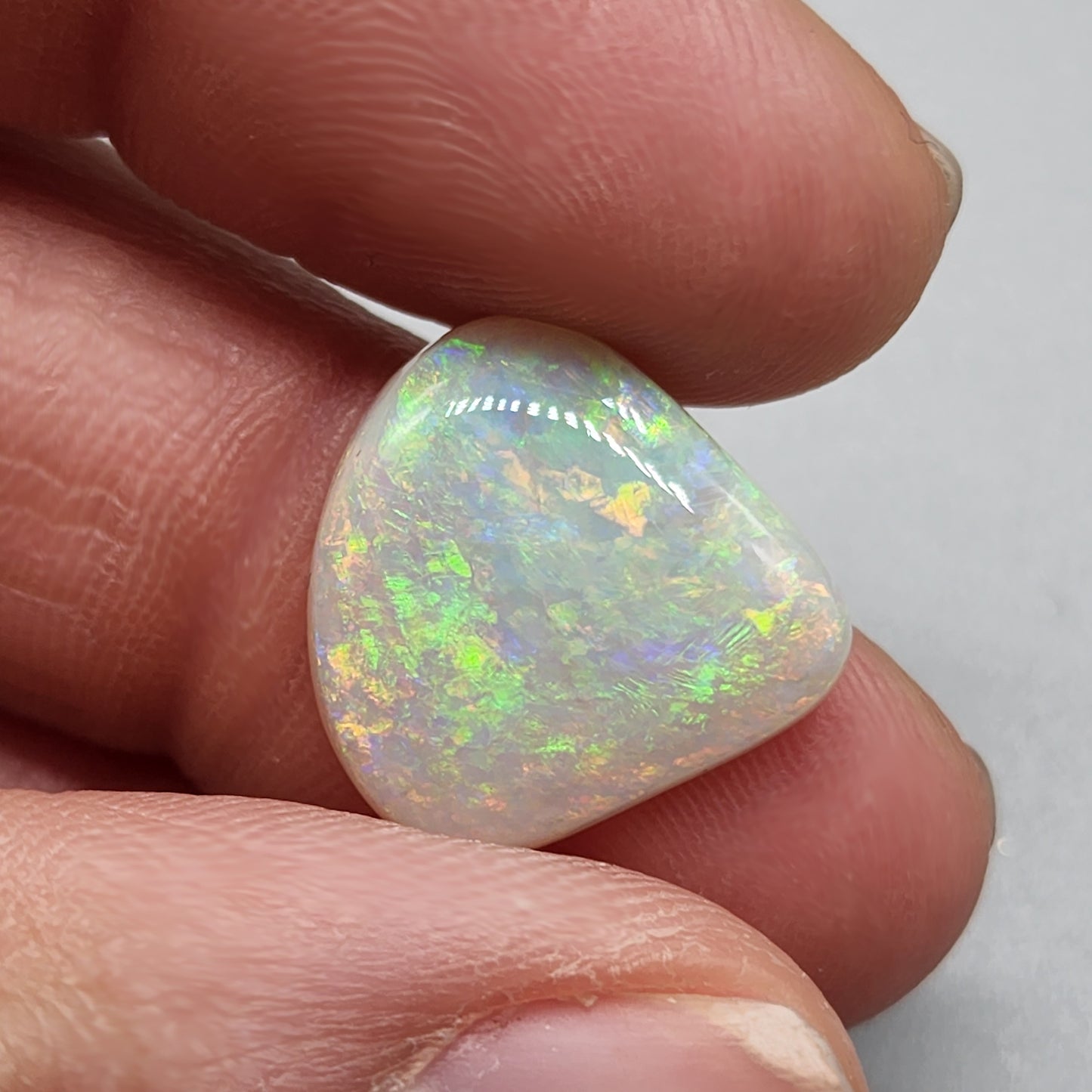 6.4cts Light Opal with yellow and orange color play