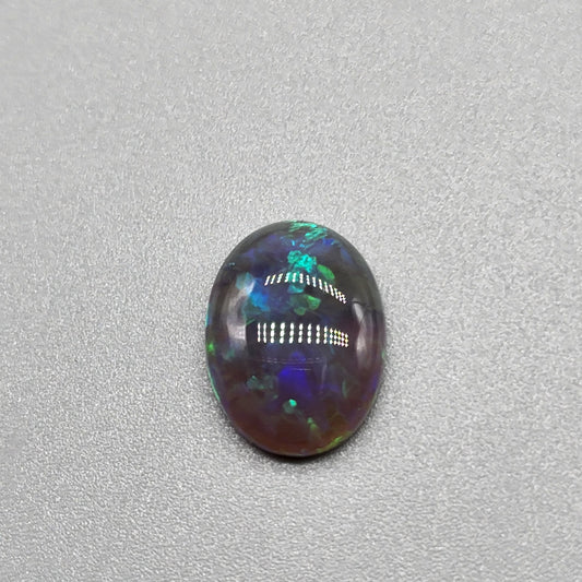 2.9cts Black Opal with organic green patterning and hints of blue.