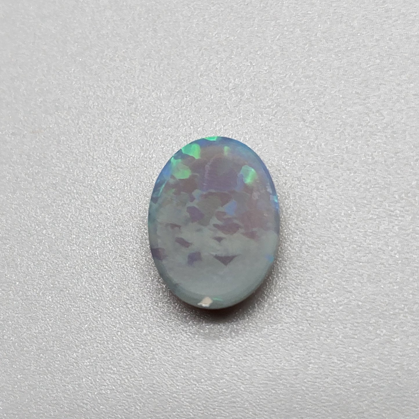 2.9cts Black Opal with organic green patterning and hints of blue.