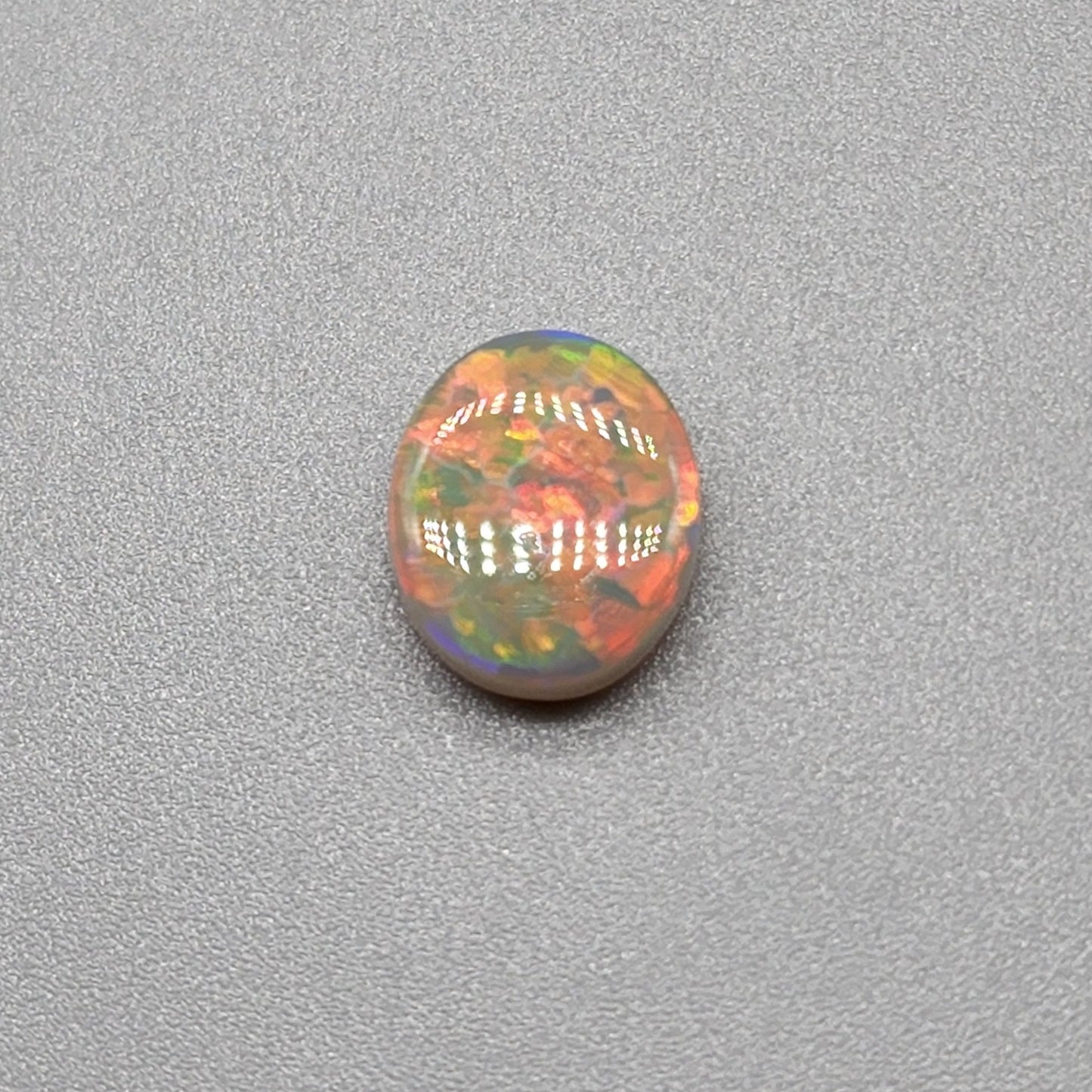 1.9cts Dark opal with an orange pink sunset pallet.