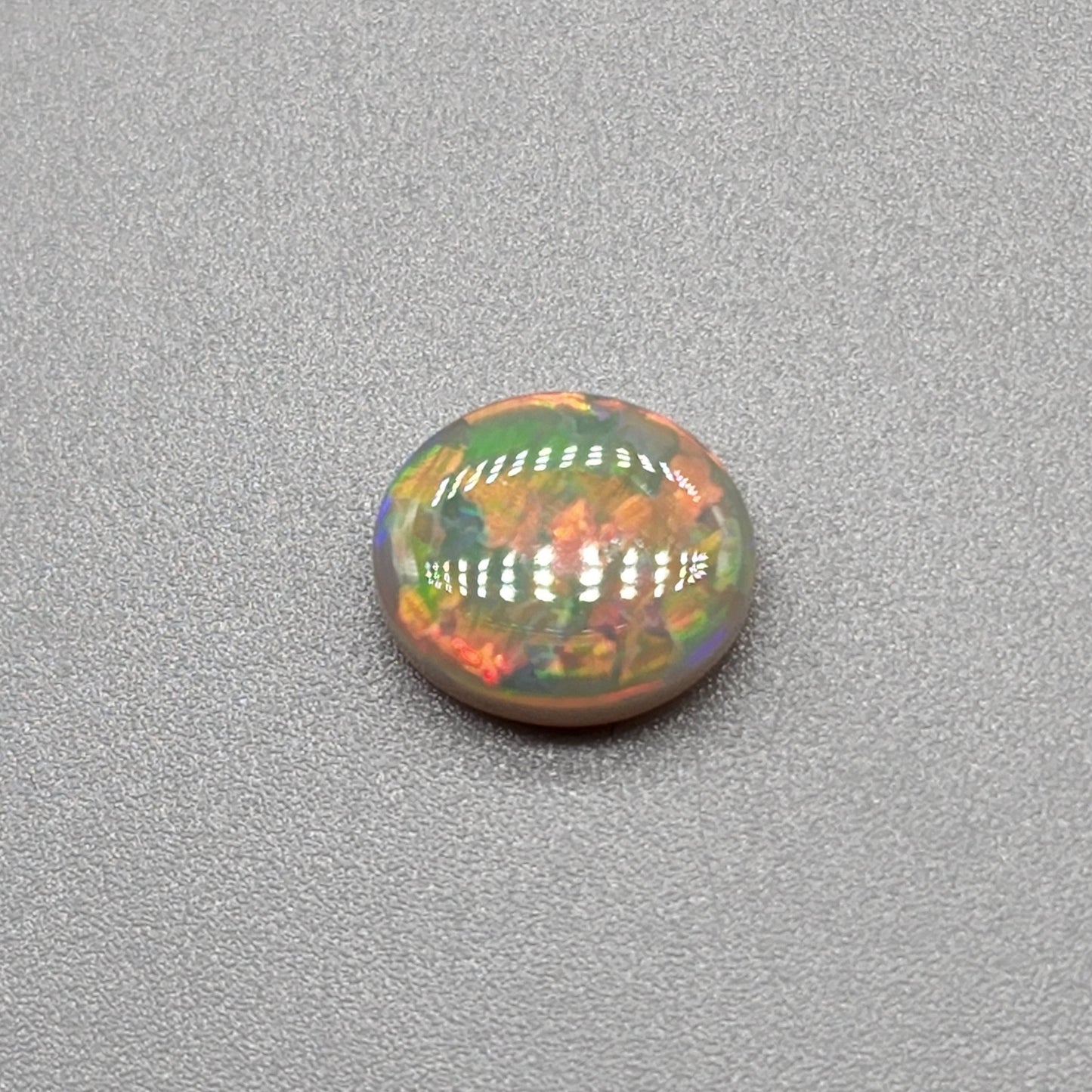 1.9cts Dark opal with an orange pink sunset pallet.