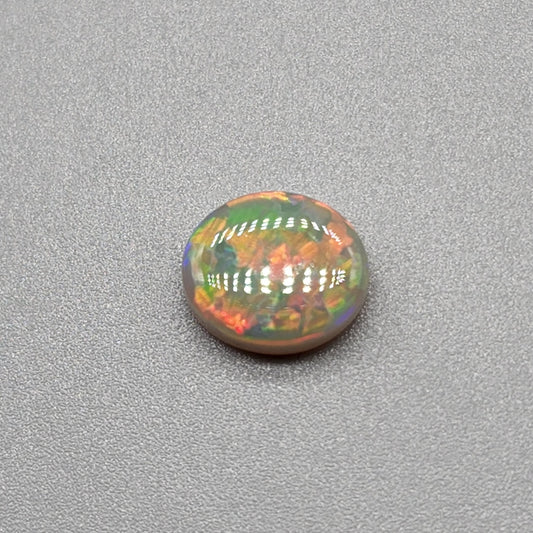 1.9cts Dark opal with an orange pink sunset pallet.