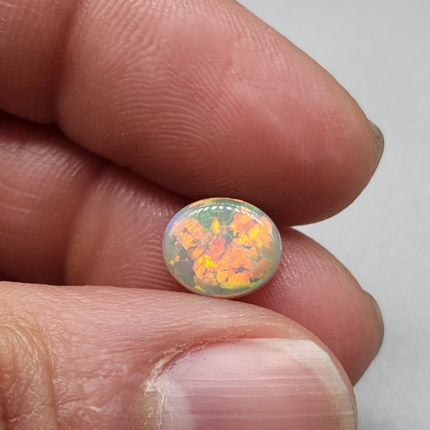 1.9cts Dark opal with an orange pink sunset pallet.