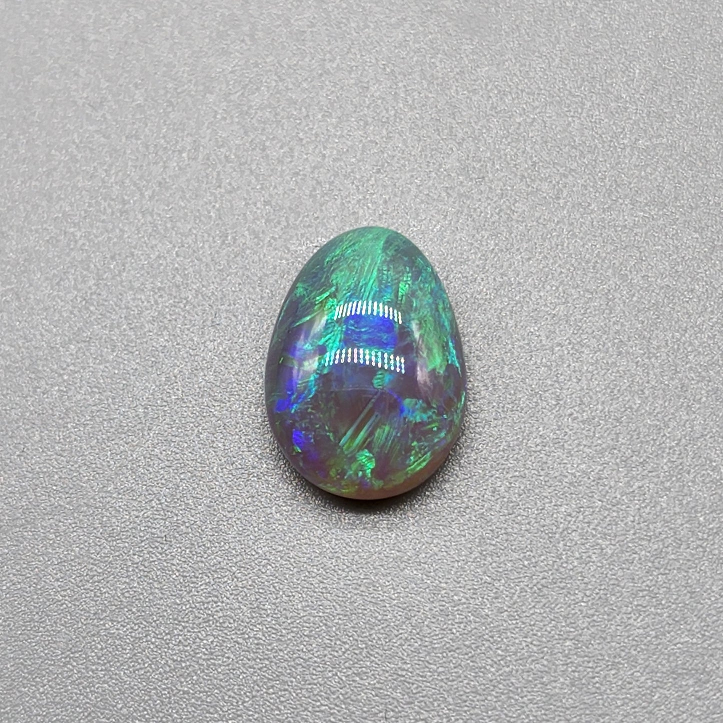 2.7cts Dark opal with bright, minty blue-green color play and well organized patterning