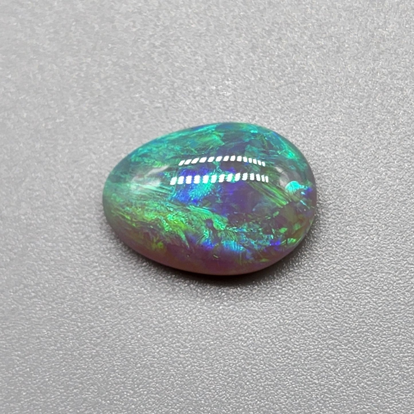 2.7cts Dark opal with bright, minty blue-green color play and well organized patterning