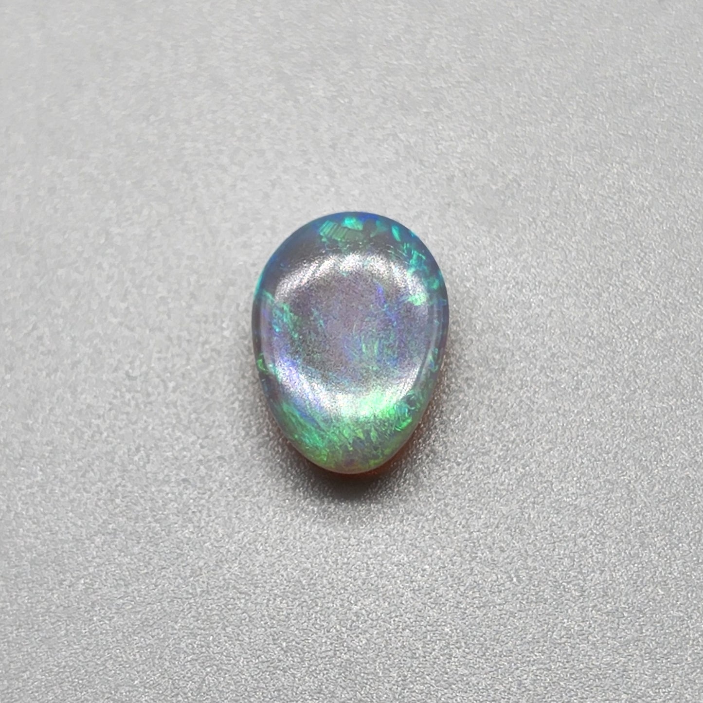 2.7cts Dark opal with bright, minty blue-green color play and well organized patterning