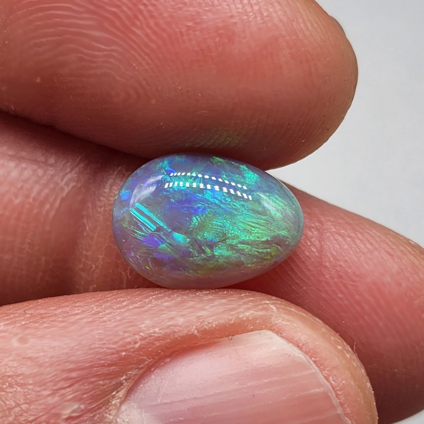 2.7cts Dark opal with bright, minty blue-green color play and well organized patterning