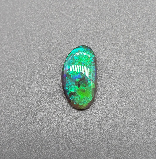 1.1cts Dark opal with vivid multi tone Green flash