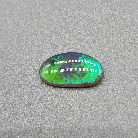 1.1cts Dark opal with vivid multi tone Green flash