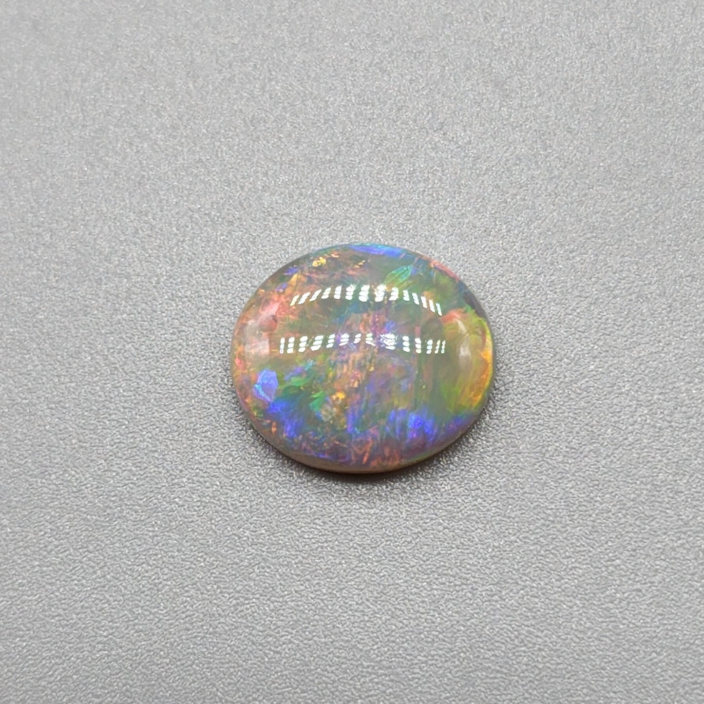 2.5cts Dark opal with bright sunset colors and mixed patterns