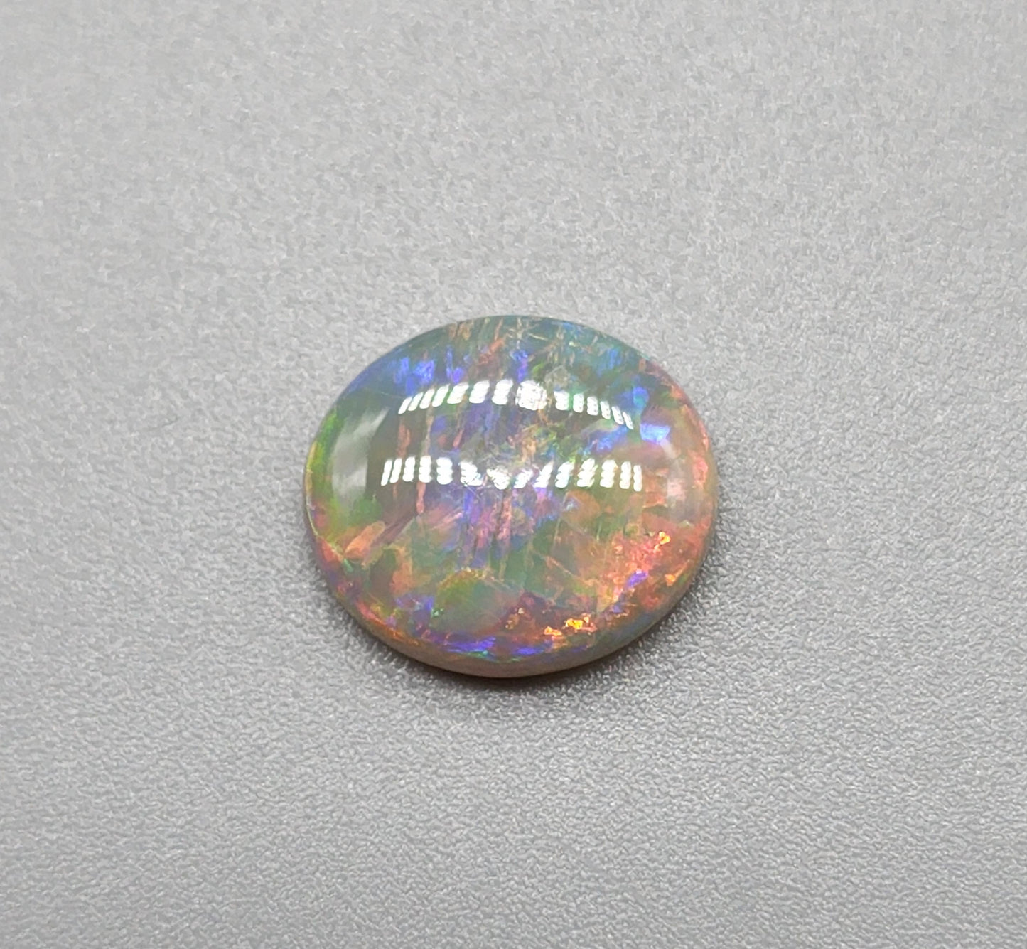 2.5cts Dark opal with bright sunset colors and mixed patterns