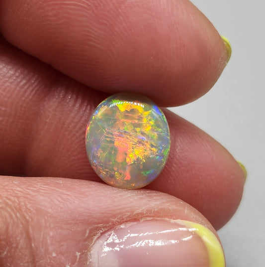 2.5cts Dark opal with bright sunset colors and mixed patterns