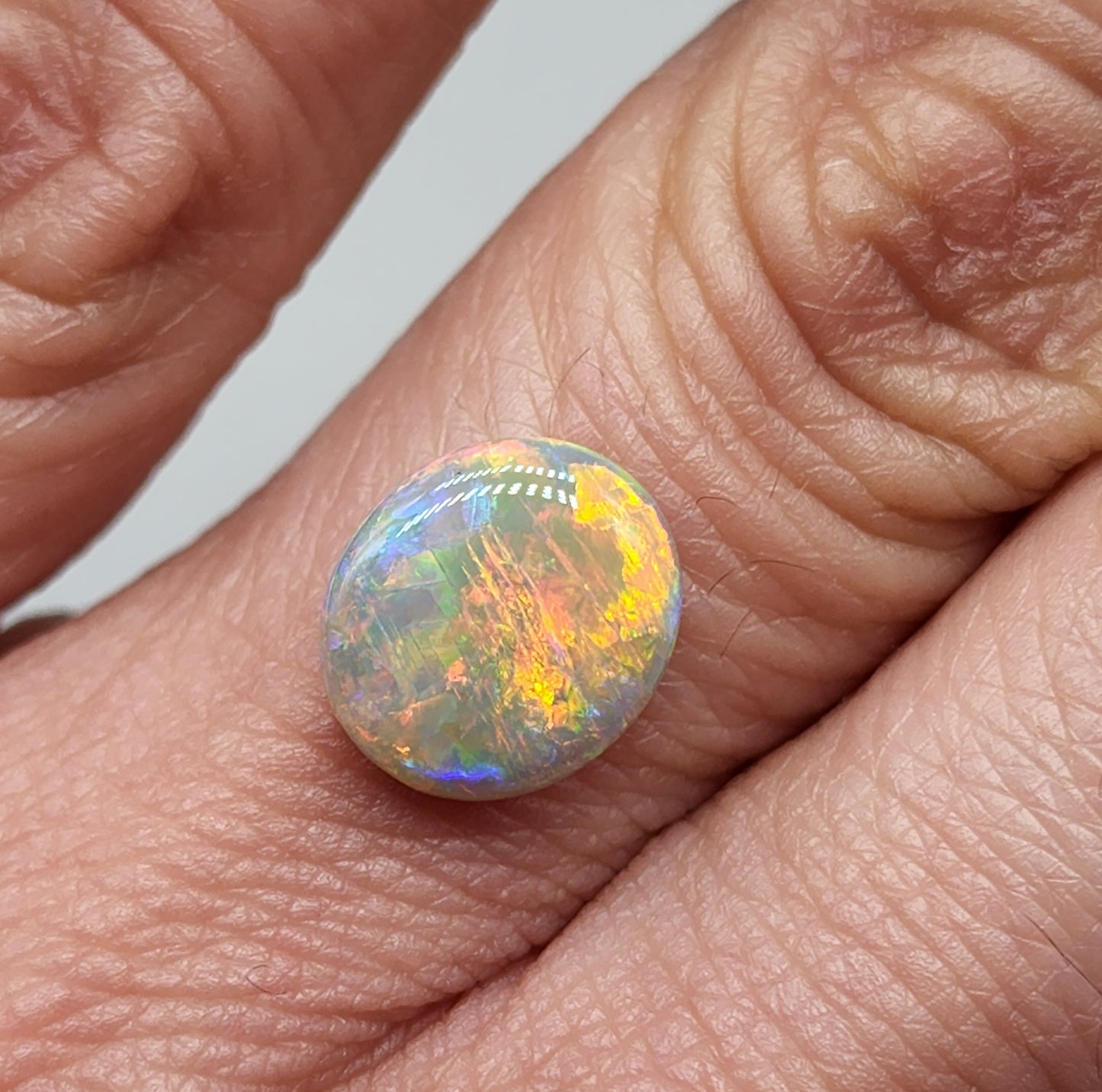 2.5cts Dark opal with bright sunset colors and mixed patterns