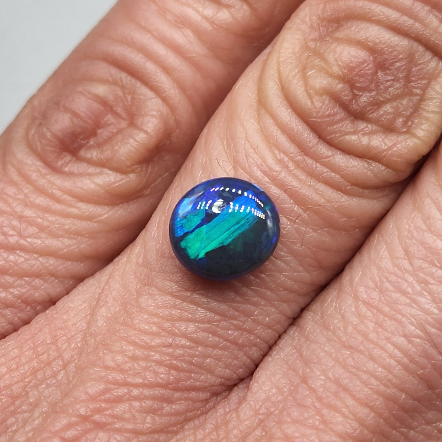 2cts Black Opal with phenomenal blue/green jigsaw pattern