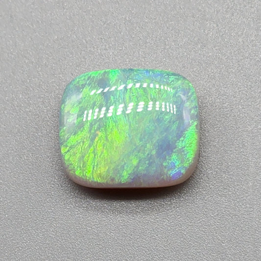 6.8cts Semi Black Opal with a lovely well dispersed moss pattern with green and yellow color play