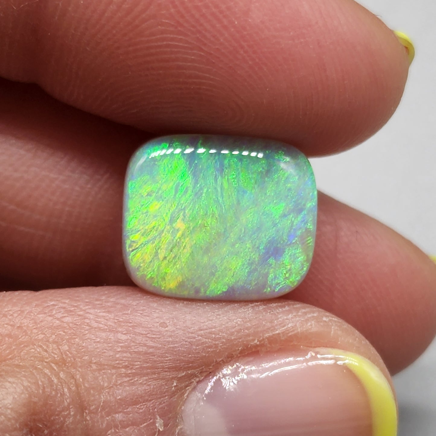 6.8cts Semi Black Opal with a lovely well dispersed moss pattern with green and yellow color play