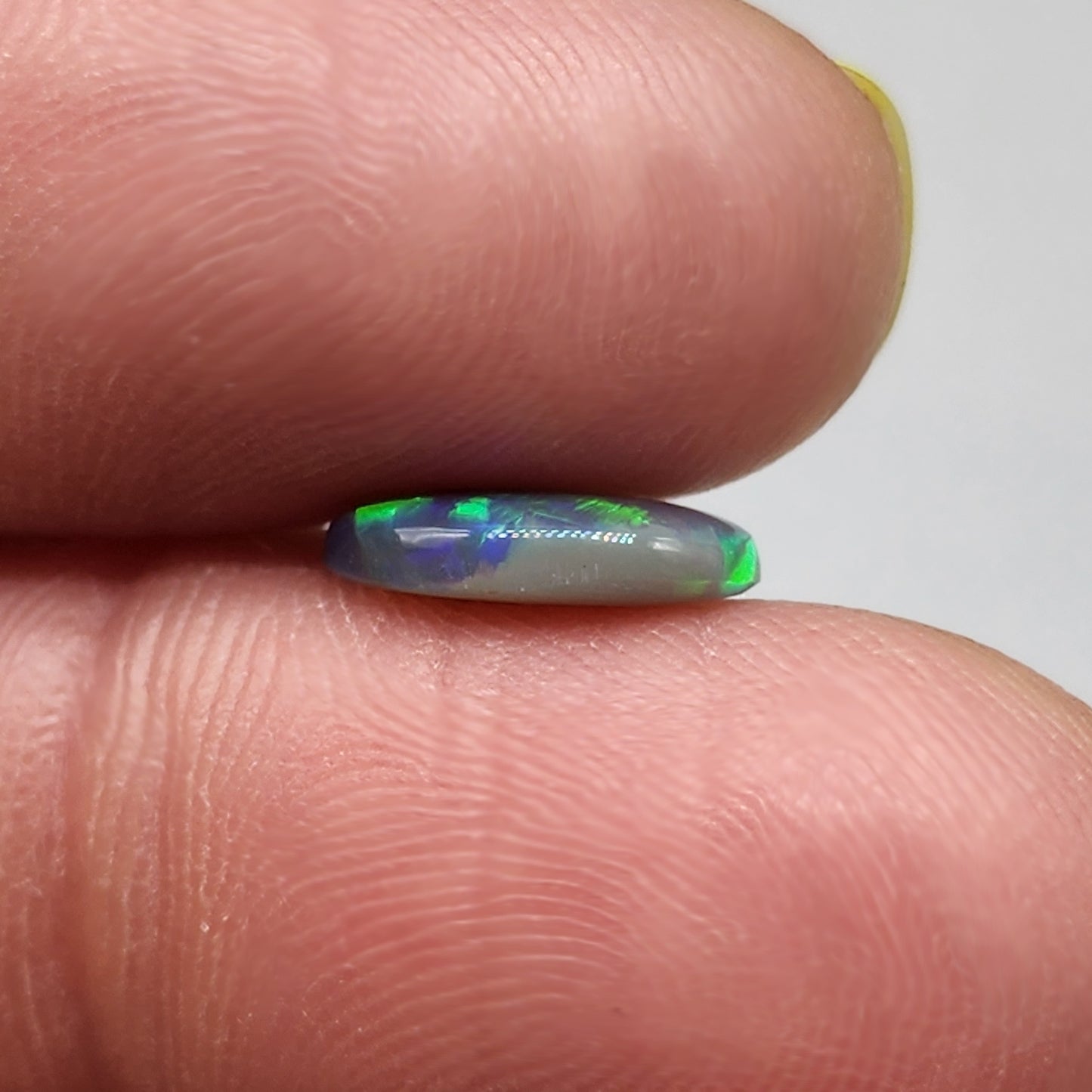 1.6cts Black Opal with a vivid green/blue color pallet and sharp aesthetic pattern