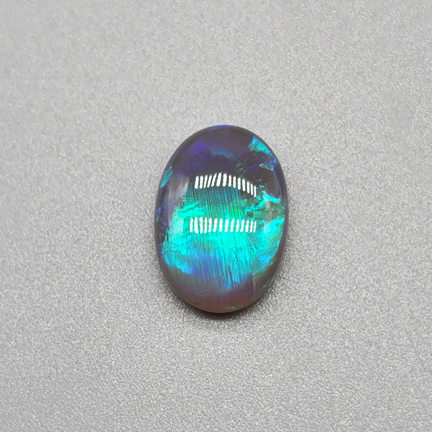 3cts Black Opal with fantastic chaff pattern with a minty green color pallet