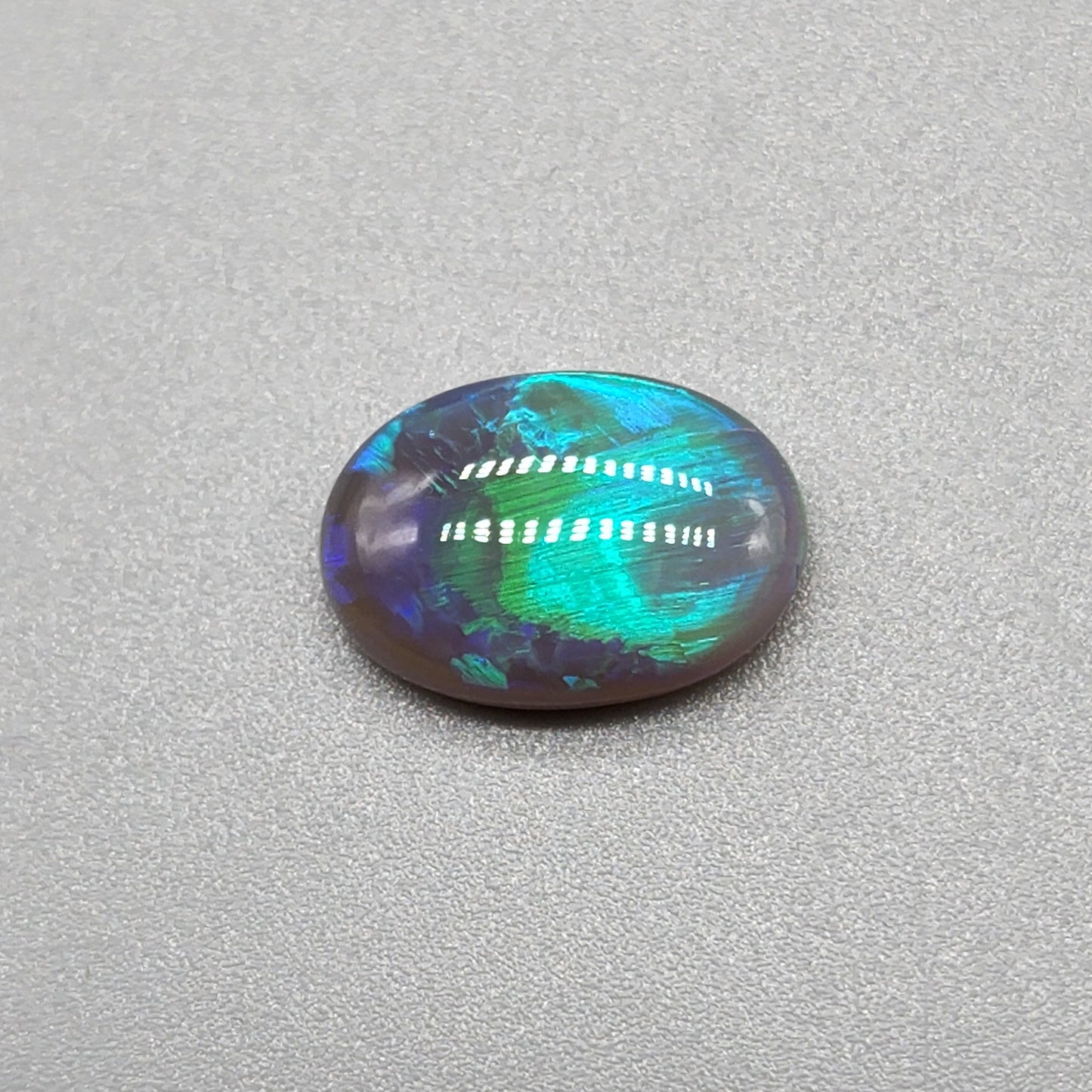 3cts Black Opal with fantastic chaff pattern with a minty green color pallet