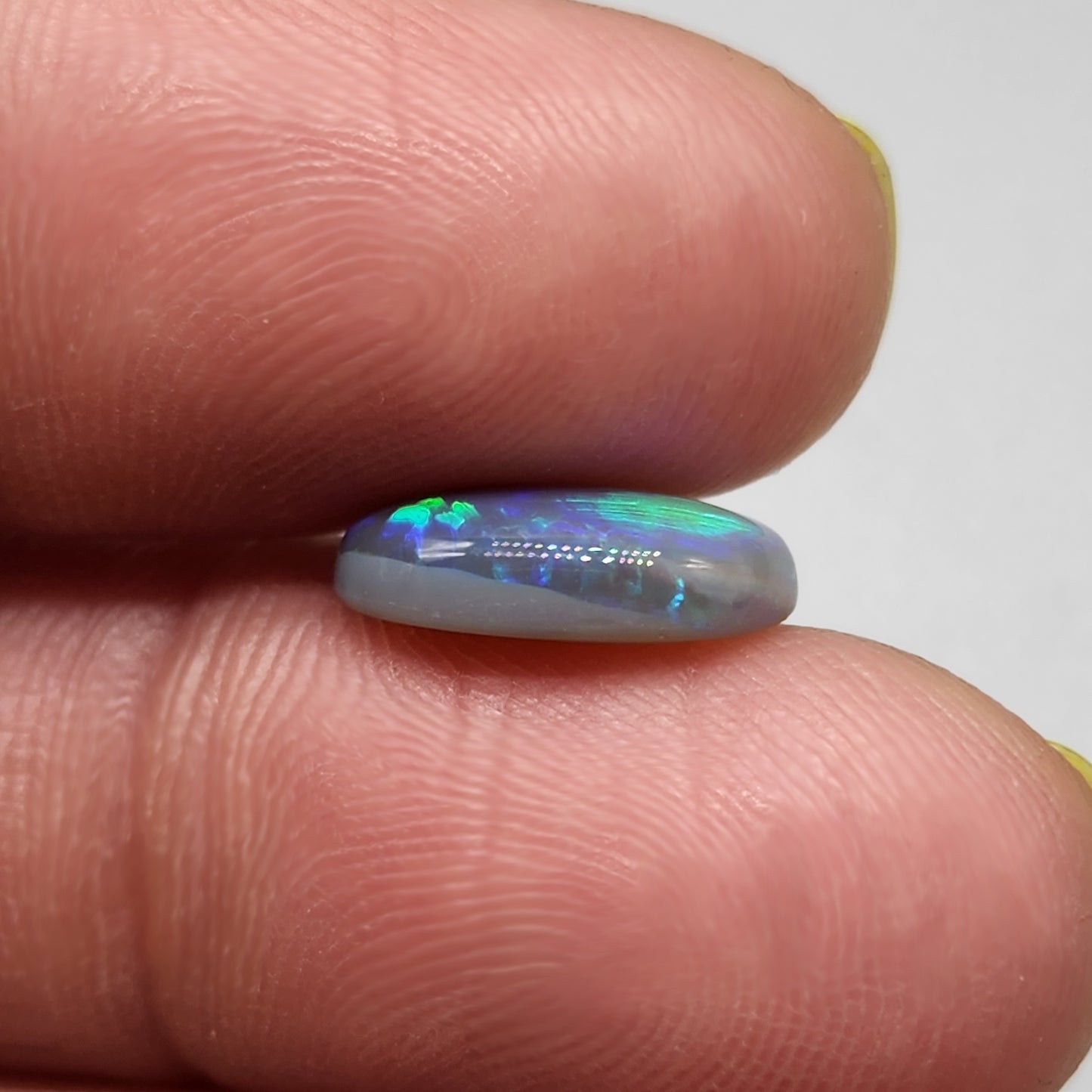 3cts Black Opal with fantastic chaff pattern with a minty green color pallet