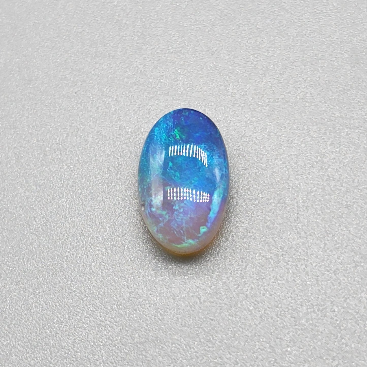 2.4cts Dark opal with an oceanic presence.