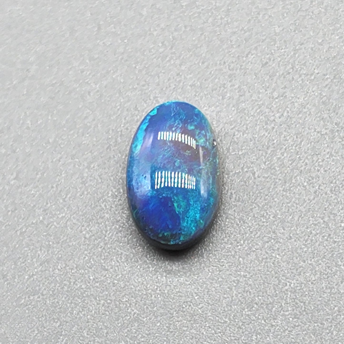 2.4cts Dark opal with an oceanic presence.