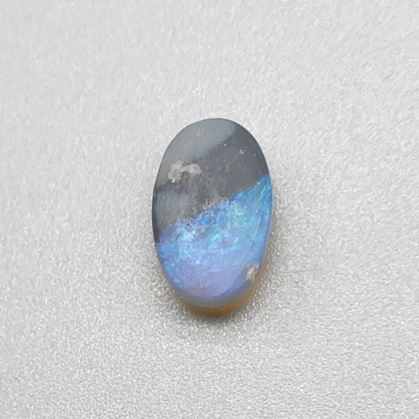 2.4cts Dark opal with an oceanic presence.