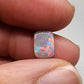 1.75cts dark opal with pink-multicolor and good color dispersal on a soft cushion cut