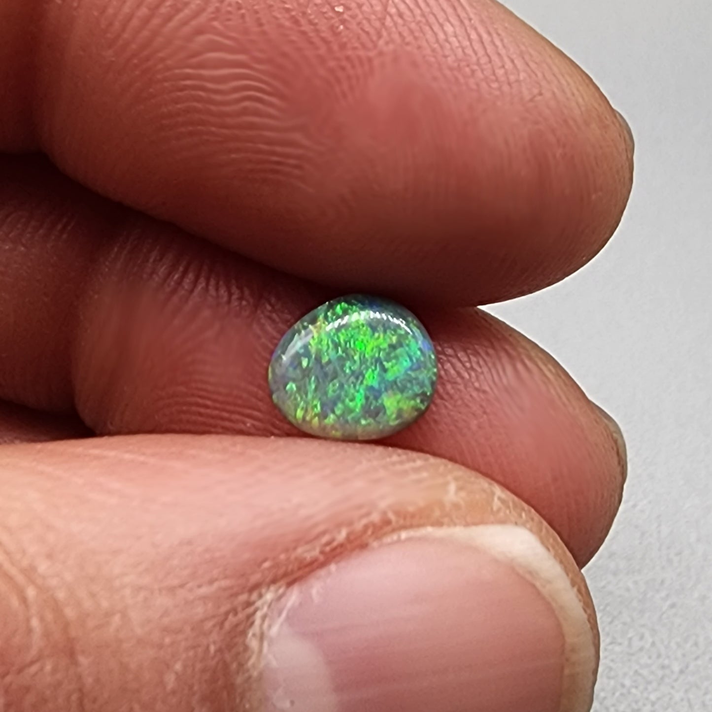 0.75cts  Black Opal with a green dominated mossy pattern and nice color dispersal