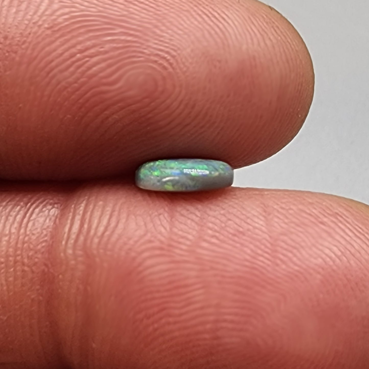 0.75cts  Black Opal with a green dominated mossy pattern and nice color dispersal