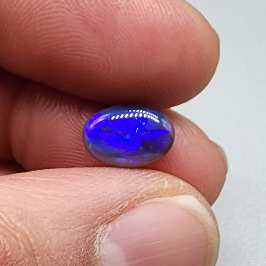 1.85cts  Black Crystal Opal with vivid but directional purple-blue  color play