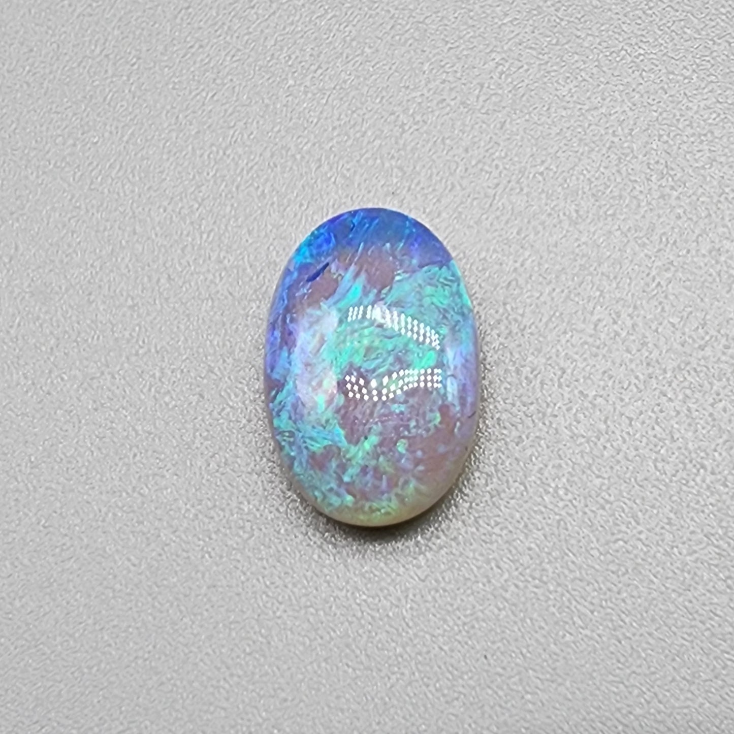 a fantastic 2.9cts Crystal Opal with pastel blues and greens and and play of color all the way through the stone giving it a lovely depth