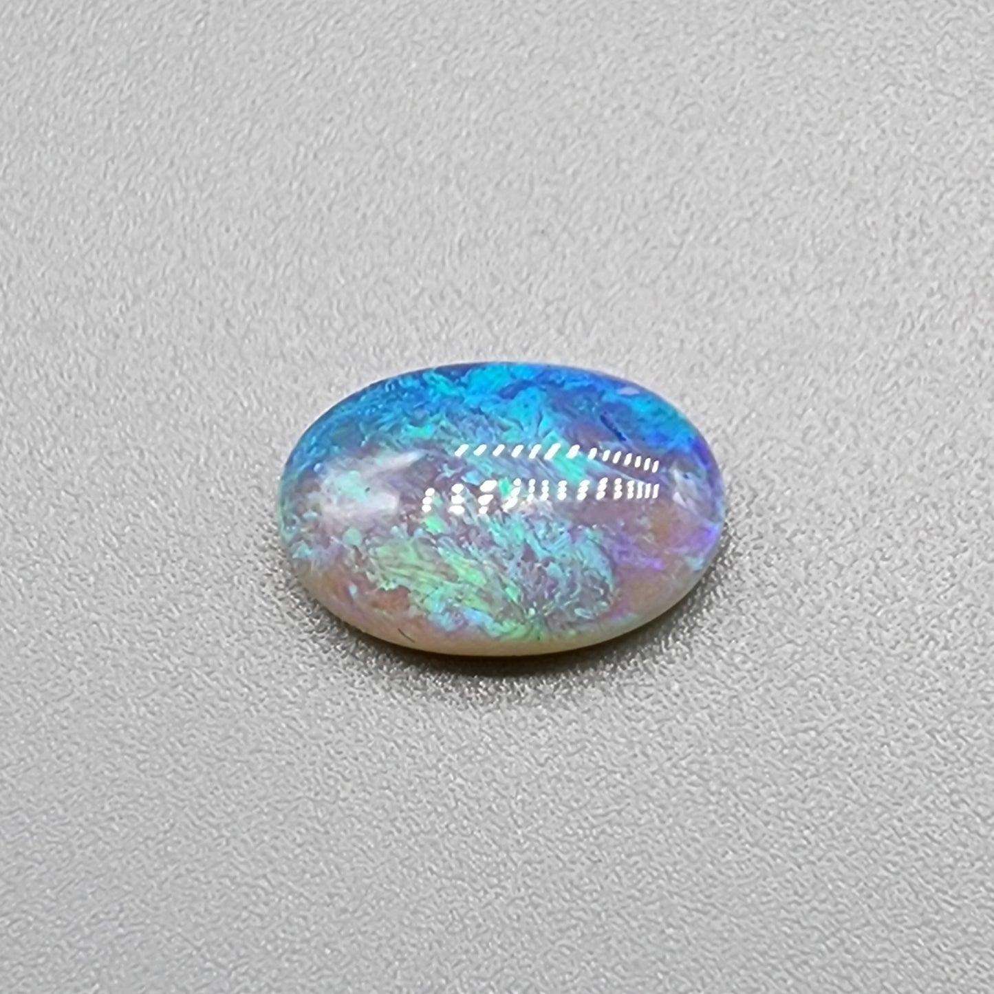 a fantastic 2.9cts Crystal Opal with pastel blues and greens and and play of color all the way through the stone giving it a lovely depth