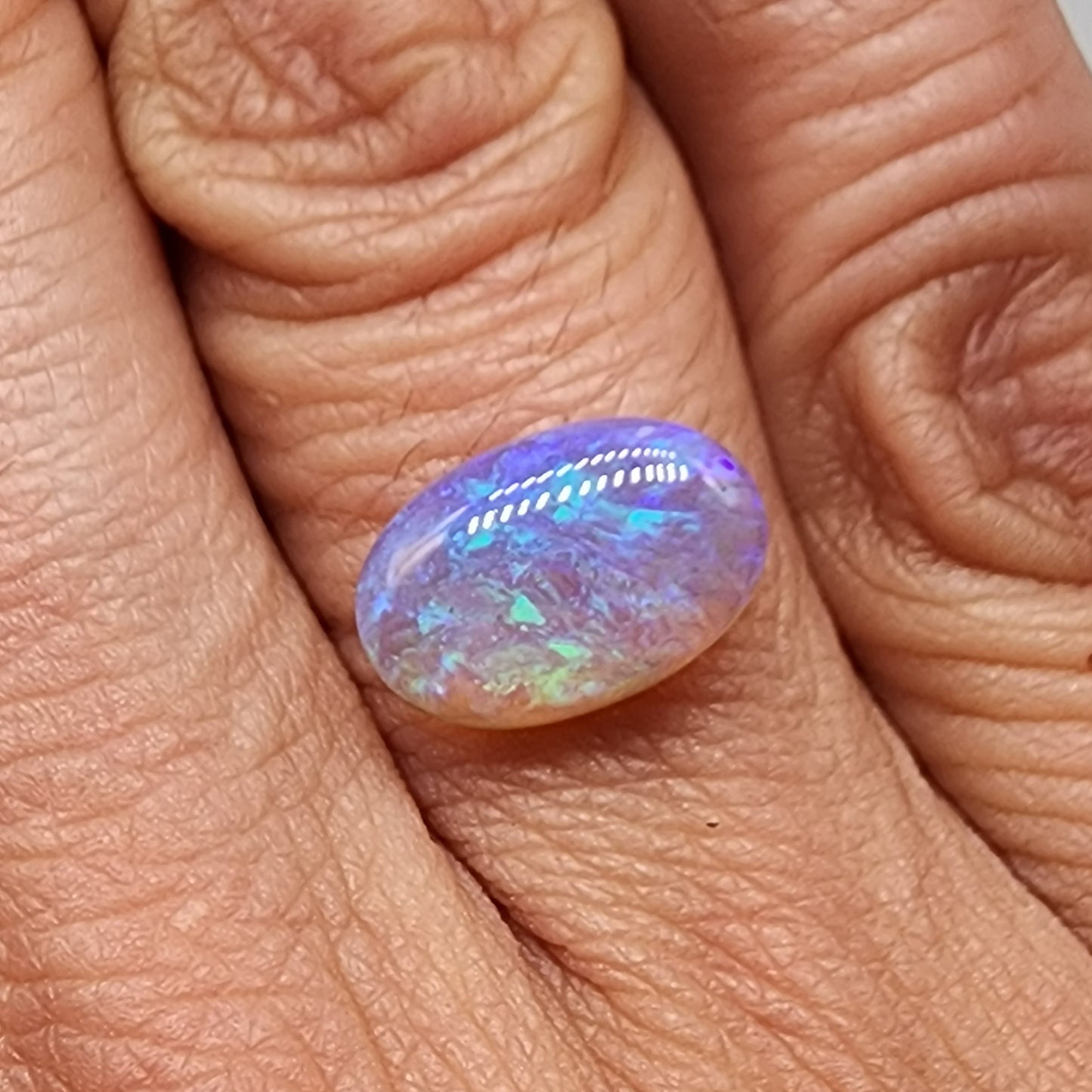 a fantastic 2.9cts Crystal Opal with pastel blues and greens and and play of color all the way through the stone giving it a lovely depth