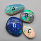 Assorted freeform Dark opal and Black Opals, all have excellent patterning and full faced color.