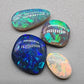 Assorted freeform Dark opal and Black Opals, all have excellent patterning and full faced color.