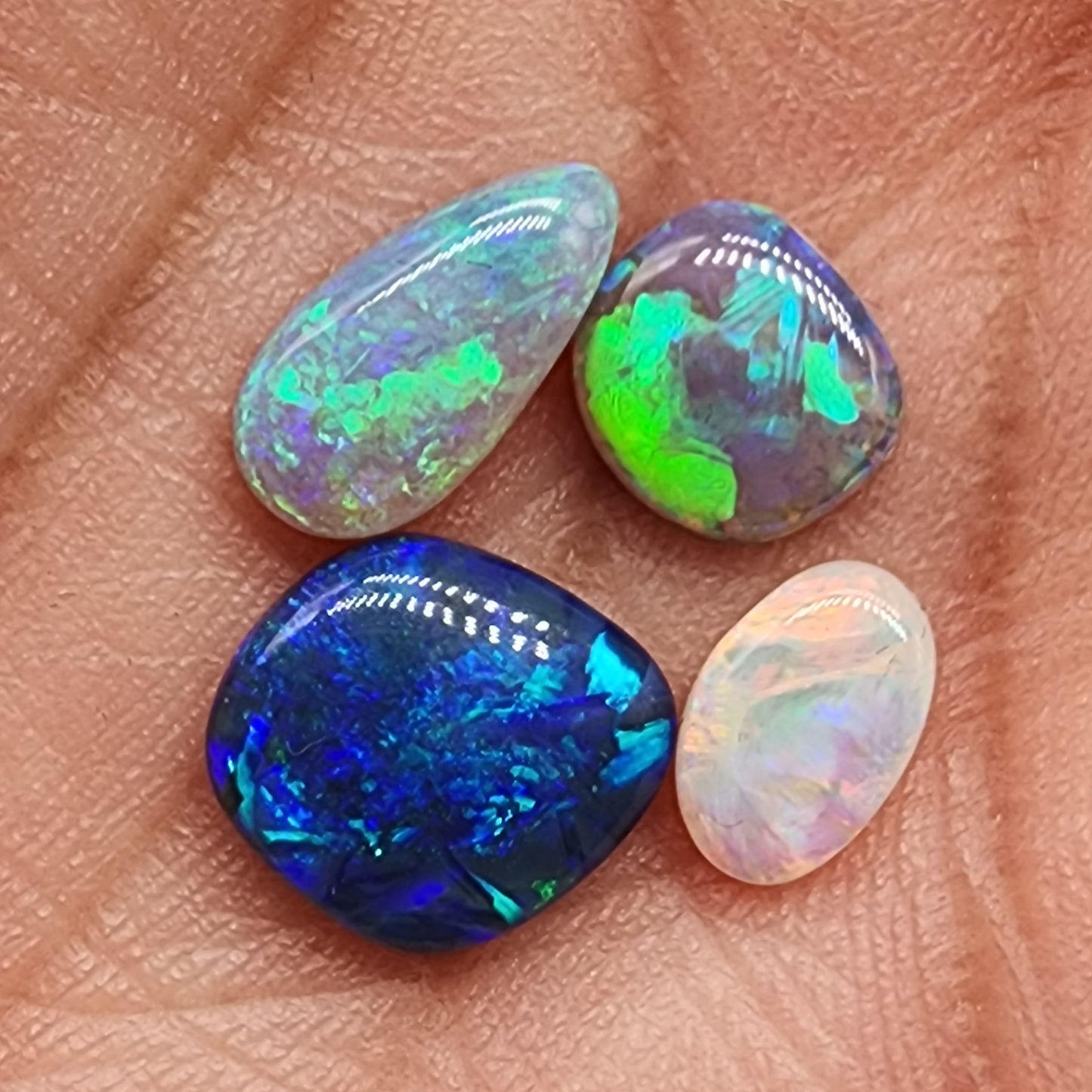 Assorted freeform Dark opal and Black Opals, all have excellent patterning and full faced color.