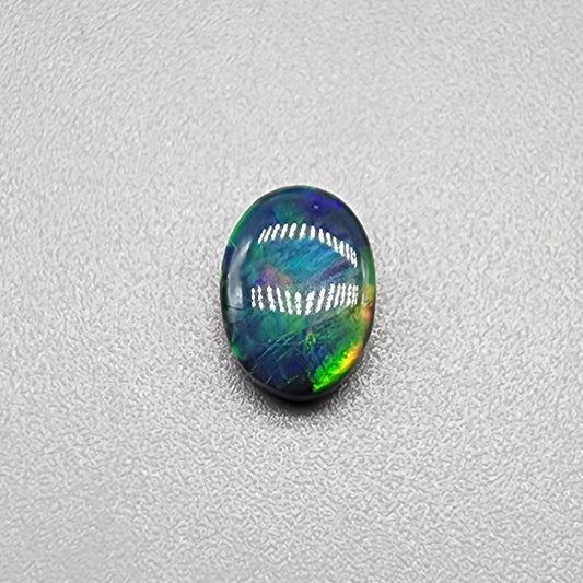 .80cts Black Opal with a Green Gold Ribbon Pattern Crossing the Stone