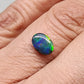 .80cts Black Opal with a Green Gold Ribbon Pattern Crossing the Stone