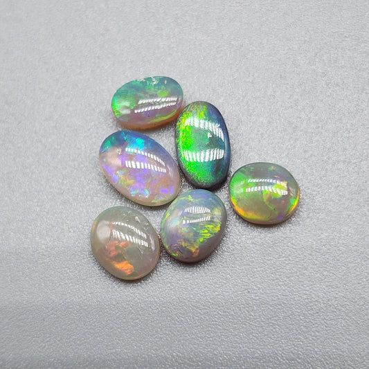 Assorted Crystal, Dark opal and Black Opals with mixed patterns and colors