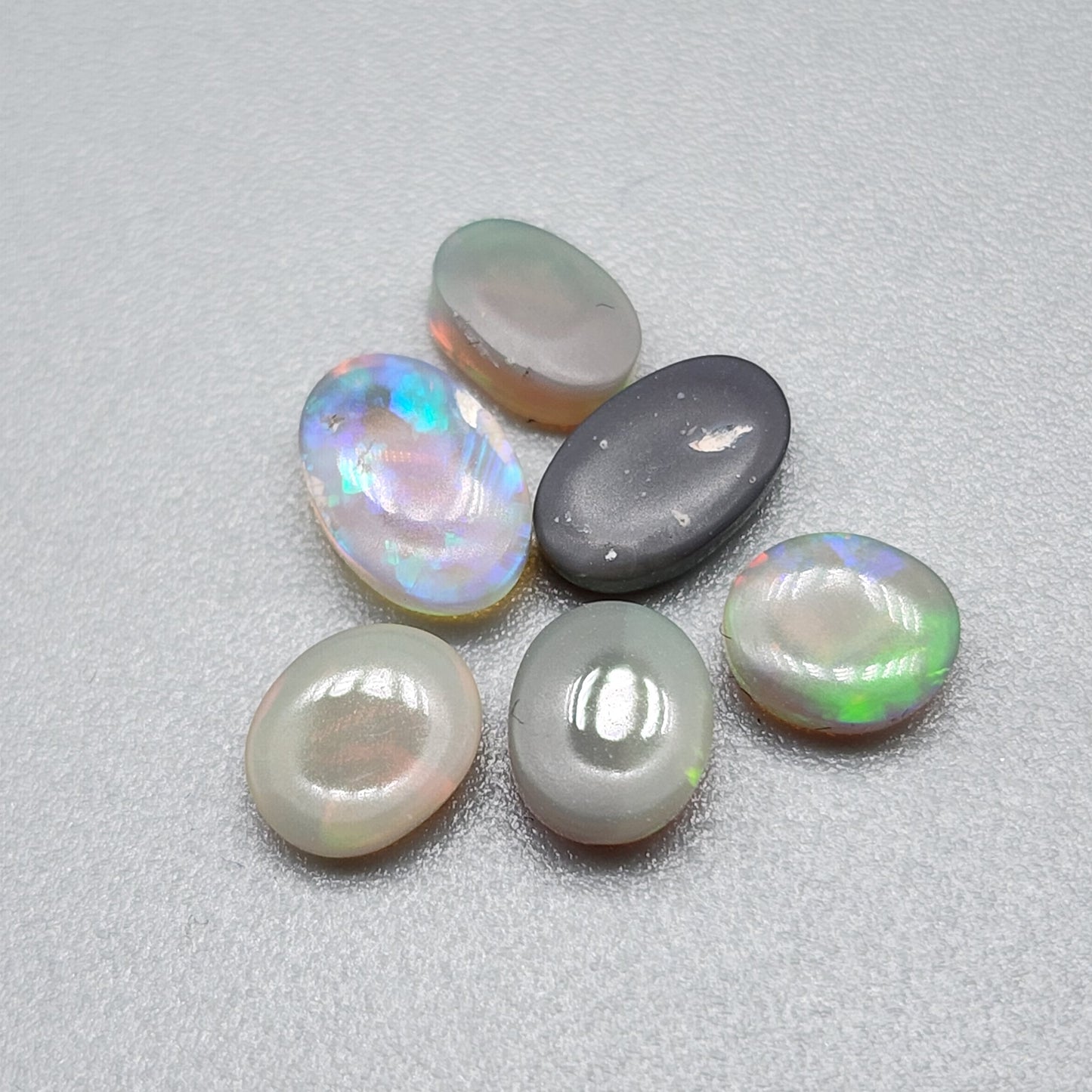 Assorted Crystal, Dark opal and Black Opals with mixed patterns and colors