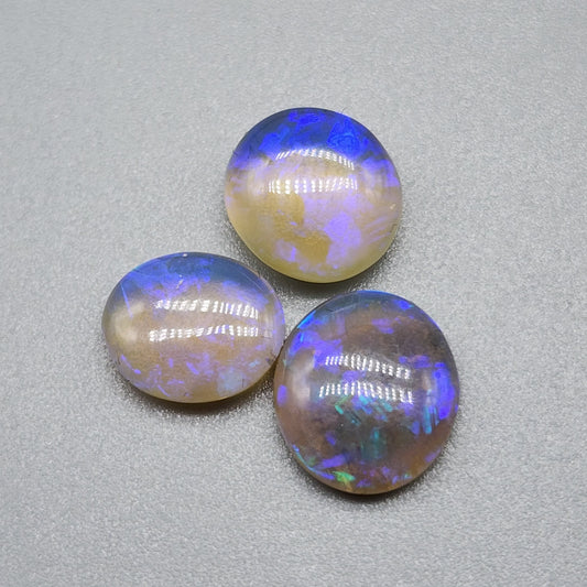 Assorted Crystal Opals with violet play of color and lots of depth.