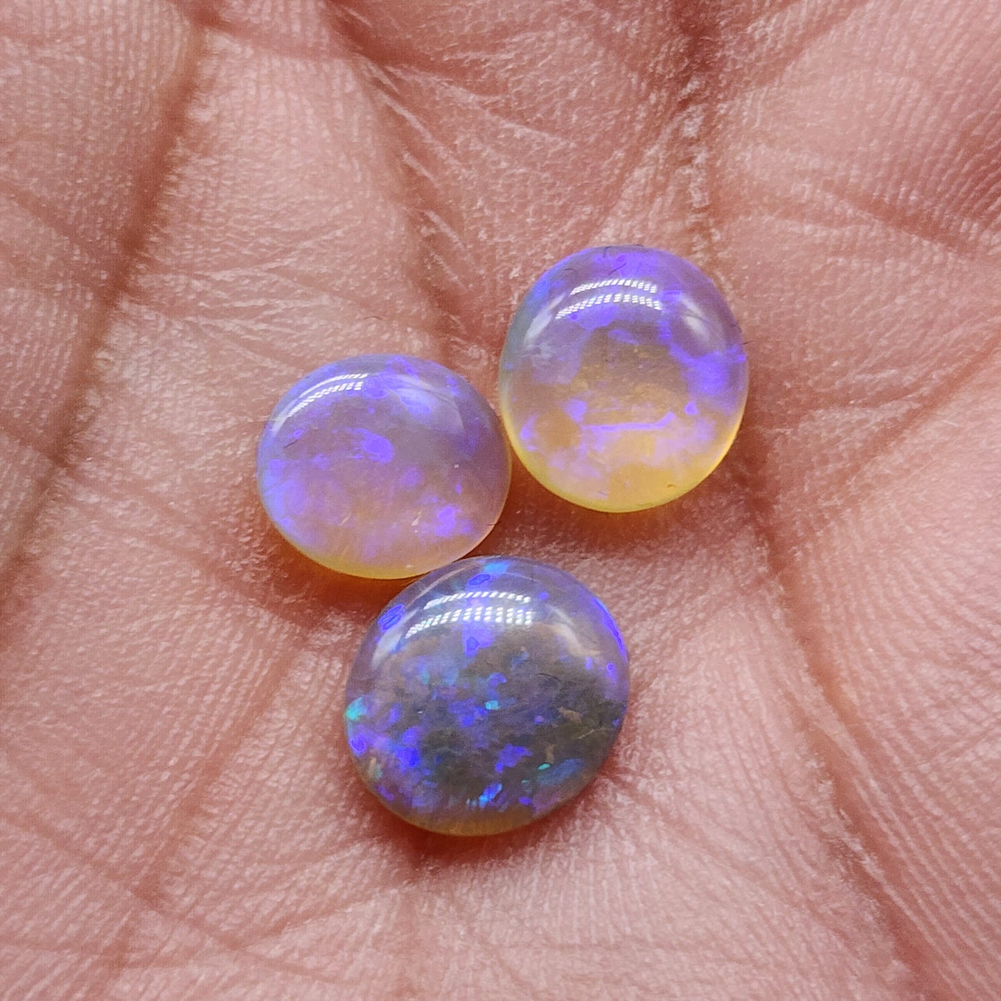 Assorted Crystal Opals with violet play of color and lots of depth.